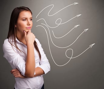 Attractive young teenager looking at multiple curly arrows